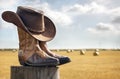 Cowboy hat and boots at ranch, country music festival live concert or line dancing concept Royalty Free Stock Photo