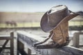 Cowboy hat and boots at ranch stables, country music festival live concert or line dancing concept Royalty Free Stock Photo