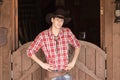 Cowboy in hat standing near saloon entrance