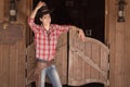 Cowboy in hat standing near saloon entrance