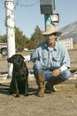 Cowboy with his dog Royalty Free Stock Photo