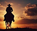 A cowboy on a horse gallops across the prairie