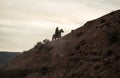 A cowboy and his dog near sundown Royalty Free Stock Photo