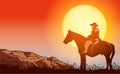 Cowboy on horse ride on sunset. Mountains on the horizon Royalty Free Stock Photo