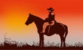 Cowboy on horse ride on sunset. Mountains on the horizon Royalty Free Stock Photo