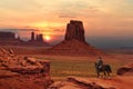 A cowboy on a horse at sunset in Monument Valley Tribal Park in Utah-Arizona border, USA Royalty Free Stock Photo