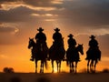 Cowboy on horseback at sunset.Silhouettes of men on horses Royalty Free Stock Photo