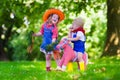 Cowboy kids playing with toy horse Royalty Free Stock Photo