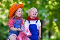 Cowboy kids playing with toy horse