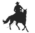 Cowboy with lasso riding a horse Royalty Free Stock Photo