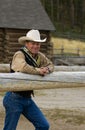 Cowboy Leans on Fence Royalty Free Stock Photo