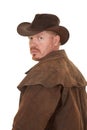 Cowboy leather duster look back serious close Royalty Free Stock Photo