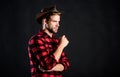 Cowboy life came to be highly romanticized. Man unshaven cowboy black background. Archetypal image of Americans abroad Royalty Free Stock Photo