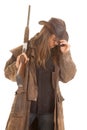 Cowboy long hair rifle over shoulder head down Royalty Free Stock Photo