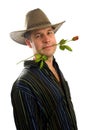 Cowboy in love with rose in mouth Royalty Free Stock Photo