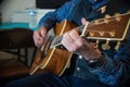 Cowboy playing western guitar Royalty Free Stock Photo