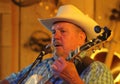 Cowboy plays guitar and sings Royalty Free Stock Photo