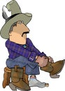 Cowboy putting on his boots Royalty Free Stock Photo