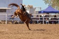 Cowboy Riding A Bucking Bronc Horse At A Country Rodeo Royalty Free Stock Photo