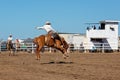 Cowboy Riding A Bucking Bronc Horse At A Country Rodeo