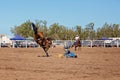Cowboy Riding A Bucking Bronc Horse At A Country Rodeo Royalty Free Stock Photo