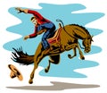 Cowboy riding a bucking bronco Royalty Free Stock Photo