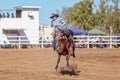 BOWEN RIVER, QUEENSLAND, AUSTRALIA - JUNE 10TH 2018: Cowboy competing in the Saddle Bronc event at Bowen River country rodeo Royalty Free Stock Photo