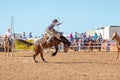 BOWEN RIVER, QUEENSLAND, AUSTRALIA - JUNE 10TH 2018: Cowboy competing in the Saddle Bronc event at Bowen River country rodeo Royalty Free Stock Photo