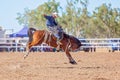 BOWEN RIVER, QUEENSLAND, AUSTRALIA - JUNE 10TH 2018: Cowboy competing in the Saddle Bronc event at Bowen River country rodeo Royalty Free Stock Photo