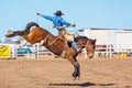 BOWEN RIVER, QUEENSLAND, AUSTRALIA - JUNE 10TH 2018: Cowboy competing in the Saddle Bronc event at Bowen River country rodeo Royalty Free Stock Photo