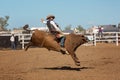 Cowboy Riding Bucking Bull At Country Rodeo Royalty Free Stock Photo