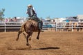 Cowboy Riding A Bucking Bull At A Country Rodeo Royalty Free Stock Photo