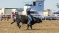 Cowboy Riding Bull At Rodeo Royalty Free Stock Photo