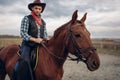 Cowboy riding a horse in desert valley, western Royalty Free Stock Photo