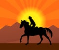 Cowboy Riding A Horse In A Sunset  Silhouette