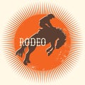 Cowboy Rodeo wild horse vector symbol. Silhouette of Cowboy riding a wild horse on red sun in symbol flat style illustration Royalty Free Stock Photo