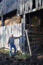 Cowboy By a Rustic Barn 2