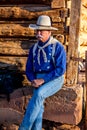 Cowboy Sitting at the Barn Royalty Free Stock Photo