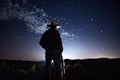 Cowboy star gazing at night sky, created using generative ai technology