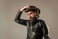 Cowboy style. fashionable man dressed in leather jacket. west fashion model. handsome man in cowboy hat. serious bearded