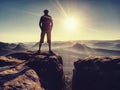 Cowboy style hiker man on cliff of park is watching over range Royalty Free Stock Photo