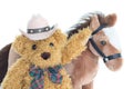 Cowboy Teddy bear and horses Royalty Free Stock Photo