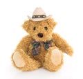 Cowboy teddy bear sitting on white Royalty Free Stock Photo