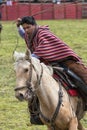 Cowboy throwing a lasso from horse back in Ecuador