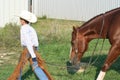 Cowboy walking horse Royalty Free Stock Photo
