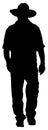 Cowboy walking silhouette vector graphic Royalty Free Stock Photo