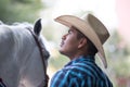 Cowboy working with a young horse.