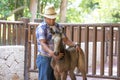 Cowboy working with a young horse.