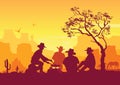 Cowboys around a campfire. Western American desert landscape Royalty Free Stock Photo