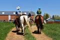 Cowboys and cowgirls headed back to the ranch Royalty Free Stock Photo